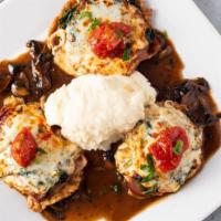 Veal Ava · Layered with prosciutto, mozzarella cheese, tomato, mushroom, served over sauteed spinach in...