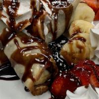Nutella Crepes · Warm Crepes Stuffed with Fresh Strawberries, Bananas, and Nutella Hazlenut Chocolate Spread ...