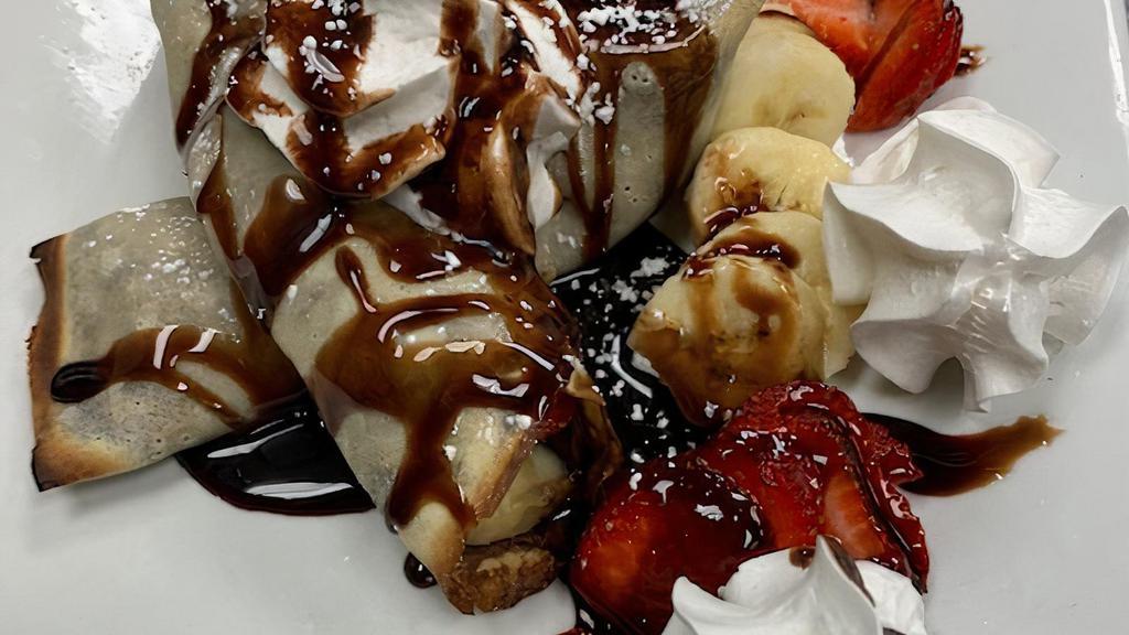 Nutella Crepes · Warm Crepes Stuffed with Fresh Strawberries, Bananas, and Nutella Hazlenut Chocolate Spread Topped with Whipped Cream