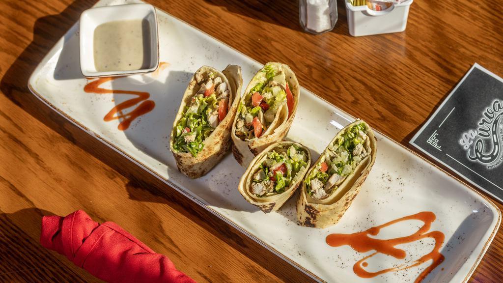 Firecracker Chicken Wraps · Spicy grilled chicken and cheese wrapped in a crispy flour tortilla and served with a cool avocado lime dipping sauce.