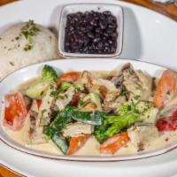 Pollo A La Crema · Chicken breast with broccoli, carrots, zucchini and heavy cream. Served with rice, beans and...