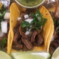 Steak Soft Tacos Order · Served with Onions Cilantro, lime and hot sauce on the side.