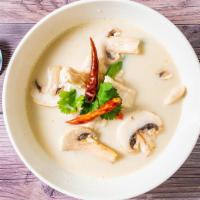 Tom Kha · Spicy lemon grass or coconut milk soup with mushrooms. Choices of chicken, shrimp, or veggies.