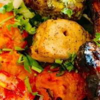 Punj Tara Non-Veg Platter · An assortment of seekh kabab, chicken basil tikka, lamb chop and tandoori shrimp.