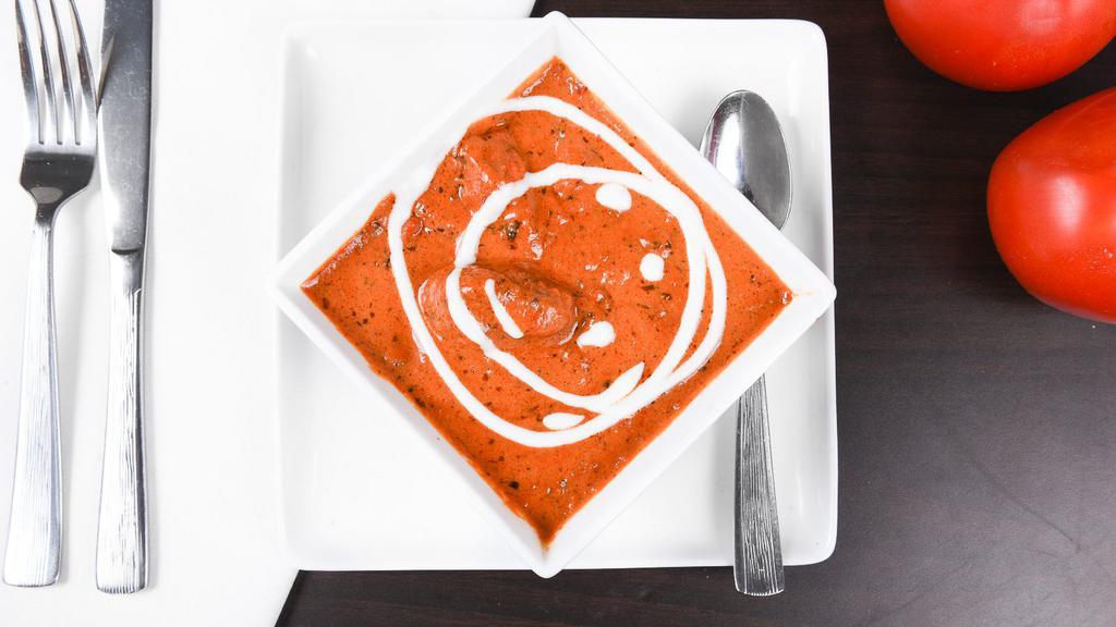 Butter Chicken · Barbecues chunks of boneless chicken cooked with onion, tomato sauce and cream.