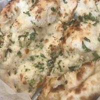 Garlic Naan · Leavened white flour bread mixed with garlic and cilantro.