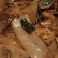 Drunken Noodles · Rice noodles stir fried in a spicy basil sauce with chilies.