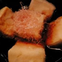 Age Tofu · Crispy fried tofu with bonito flakes in tempura sauce.