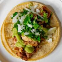 Grilled Chicken Taco · Soft taco served on a warm corn tortilla with onion, cilantro, green salsa