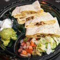 Grilled Chicken Quesadilla · Grilled chicken with melted jack cheese. Served with pico de gallo, guacamole and sour cream.