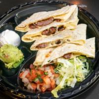 Grilled Skirt Steak Quesadilla · Grilled skirt steak with melted jack cheese. Served with pico de gallo, guacamole and sour c...