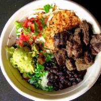 Grilled Steak Burrito Bowl · Grilled skirt steak served in a bowl with rice, beans, cheese, tomato, cilantro, scallion an...