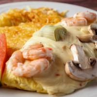Seafood Omelette · Chunks of crabmeat, baby shrimp mushrooms and artichoke hearts, topped with pepper jack chee...