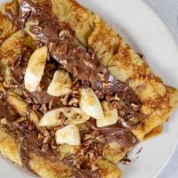 Nutella Crepes Deluxe · Three crepes filled with bananas and topped with nutella toppings, sprinkled with Georgia pe...