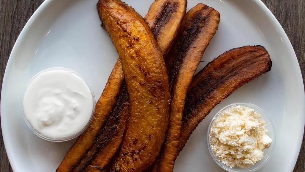 Sweet Yellow Plaintain · 4 pieces of golden fried sweet plantains. Served with fresh cheese and sour cream.
