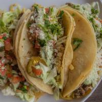Tacorito Tacos · Topped of with coleslaw, fresh jalapenos, fresh cilantro, lime juice, onion, guacamole, Crea...