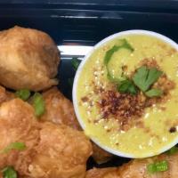 Roti Puffs With Curry Dip · Crunchy roti puffs (Malaysian pancake puffs) with yellow curry dip. Topped with crushed pean...