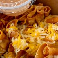 Dirty Wontons · Deliciously crispy chicken wontons topped with cheese and spicy mayo.  (6 pc)
