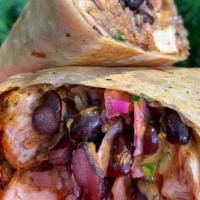 Fish Burrito · A flour tortilla, battered vegan fish, mexican rice, black beans, pico de gallo, chipotle cr...