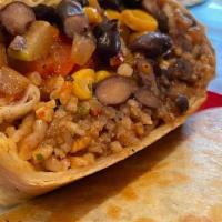 Veggie Burrito · Our delicious black beans, rice, pico de gallo, red house salsa and our seasonal veggies (on...