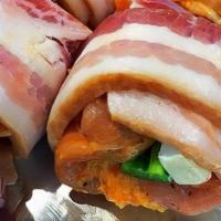 Chicken Wraps · Chicken stuffed with pork and pepper jack sausage, wrapped in bacon.

2 Skewers per pack.