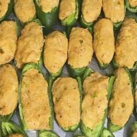 Seafood Stuffed Jalapeños · Jalapeno stuffed with our homemade seafood stuffing. 

9 per pack.