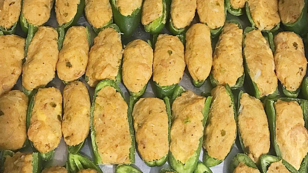 Seafood Stuffed Jalapeños · Jalapeno stuffed with our homemade seafood stuffing. 

9 per pack.