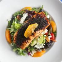 Brown Sugar Salmon Salad · Brown sugar-ancho chile crusted Atlantic salmon, roasted on a cedar plank, over mixed greens...