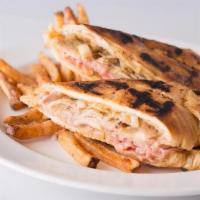 Grilled Cuban Sandwich · Slow roasted pork and ham, Swiss cheese, chipotle mayo and pickle relish, . baked then grill...