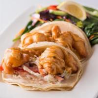 Gulf Coast Shrimp Tacos · Two corn tortillas stuffed with fried Gulf shrimp, zesty coleslaw and chipotle-lime sauce, s...