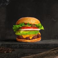 Avocado Avalanche Vegan Burger · Seasoned plant-based patty topped with avocado, melted vegan cheese, lettuce, tomato, onion,...