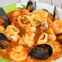 Seafood Combo · Served w/ shrimp, scallops, mussels & calamari.