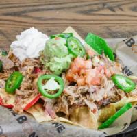 Pulled Pork Nachos · House made queso, pico-de-gallo, and sour cream. Add jalapenos for an additional charge.