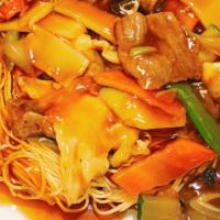 House Pan Fried Noodles · Crispy pan fried noodle, topped with chicken, beef, shrimp and vegetable in light brown sauce.