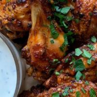 Chicken Wing (5) · Chicken wings marinated in spices & baked.