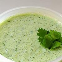 Raita · Fresh yogurt whipped and blended with cumin shredded cucumber and cilantro.