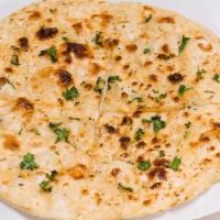 Garlic Naan · Clay oven baked bread brushed with fresh garlic.