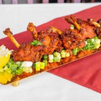 Kozhi Lollipop · Chicken wings, battered in spices and deep fried.