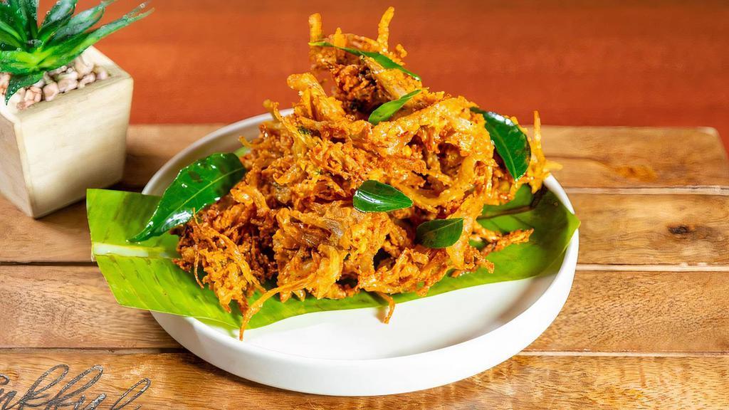 Uthiri Onion Pakoda · (Vegan) Julienne onions, masala powders, curry leaves, crushed garlic & besan flour; deep fried.