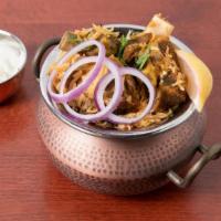 Dum Goat Biryani · The perfect delicacy made with the choicest cuts of goat, dum cooked with saffron hued basma...