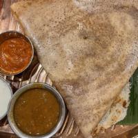Mysore Masala Dosa · (Vegan; contains nuts) Crispy rice crepe topped with Mysore chili paste, served with chutney...