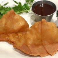 Veggie Samosa · (Savory pastry stuffed with potatoes and green peas) served with sweet tamarind and spicy ch...