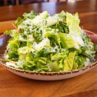 Caesar Salad · Gluten free, arugula, romaine, parmesan, creamy garlic dressing.