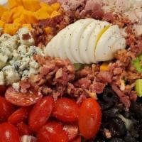 Cobb Salad · Iceburg Lettuce, Diced Bacon, Egg, Cherry Tomatoes, Black Olives, Avocado, Cheddar,
Ham, Tur...