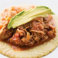 Tinga · Shredded chicken breast braised with tomatoes, cabbage, chorizo and chipotle. Served with ch...