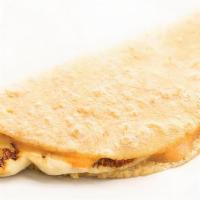 Quesadilla · Queso panela grilled and topped with chipotle crema.