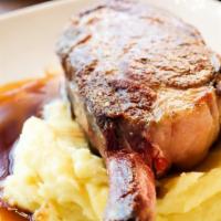 16Oz Bone In Ribeye · Served with mashed potatoes and a choice of demi-glace or compound butter