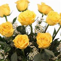 Dozen Yellow Roses · Flower arrangement
clear gathering vase, greens: salal, seeded eucalyptus, flowers: yellow r...