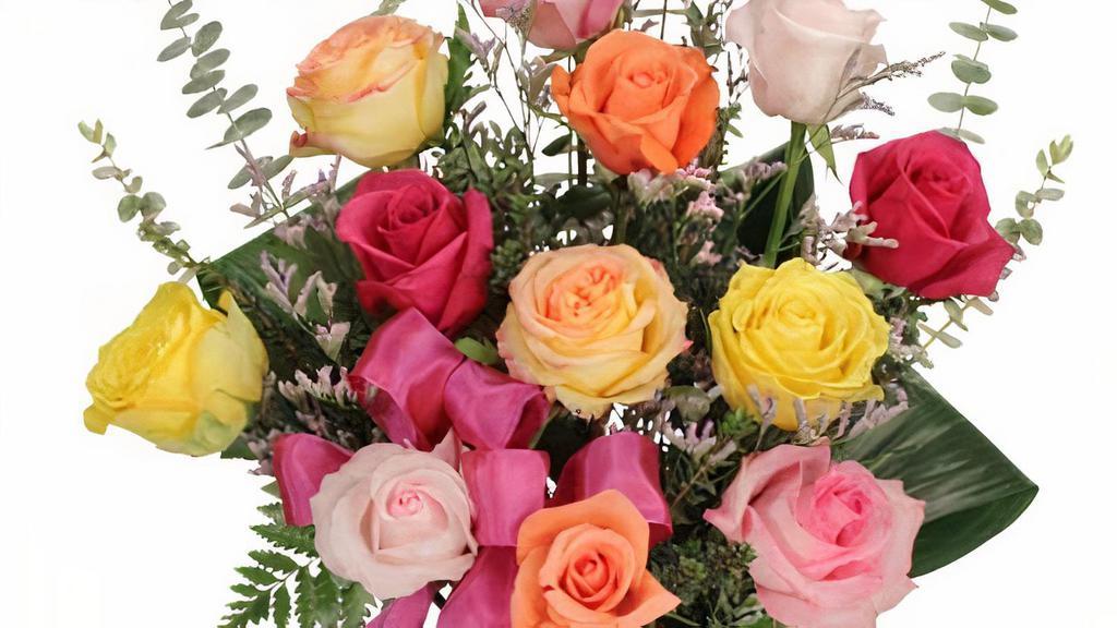 Rainbow Of Roses · Arrangement
tapered glass vase, foliage: aspidistra leaves, leather leaf, baby blue eucalyptus, roses, assorted colors, (shown: yellow, peach, variegated yellow roses, light pink, medium pink, hot pink roses), bupleurum, caspia, medium pink ribbon.

Share the colors of the rainbow with this stunning bouquet! With gorgeous yellow, peach, red, and pink roses, rainbow of roses is a rose lover's dream come true. Send this stylish arrangement and show your love with roses! It's sure to make them smile and brighten their day!