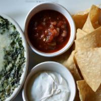 Spinach Artichoke Dip · Fresh spinach, artichoke hearts, and onions, blended with Monterey Jack tossed in a Parmesan...